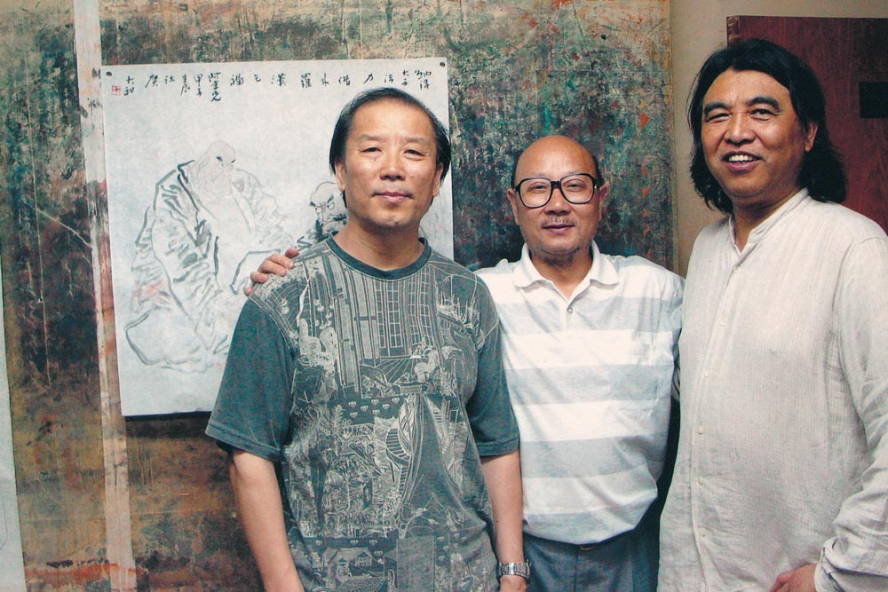 与程大利、杨明义合影于北京
