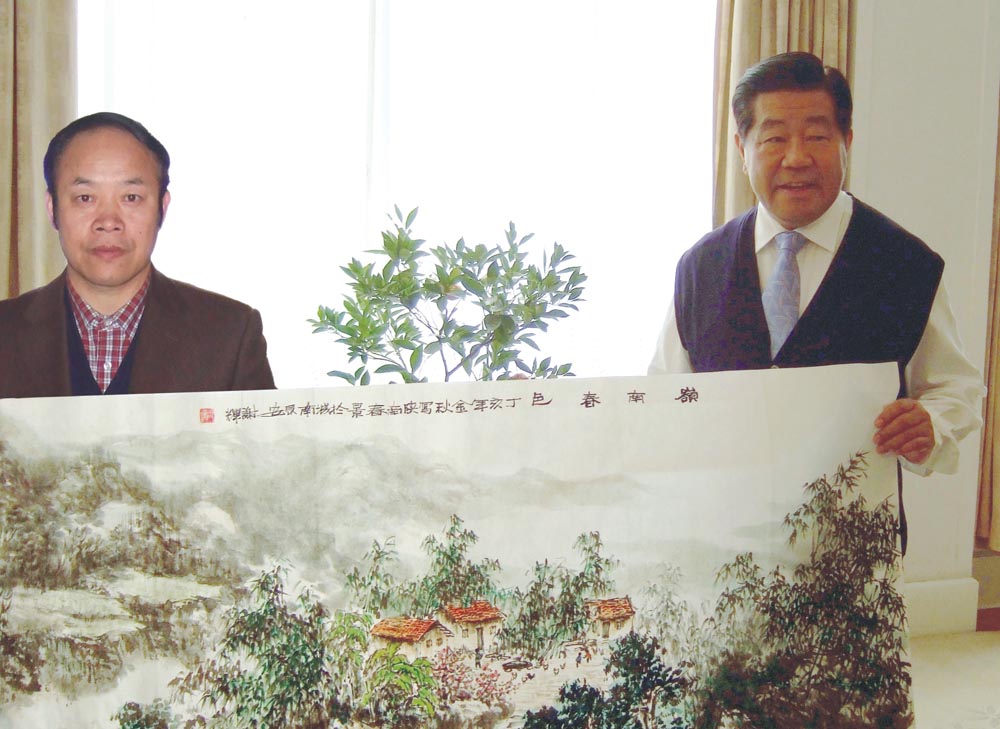 谢辉与贾庆林先生合影留念