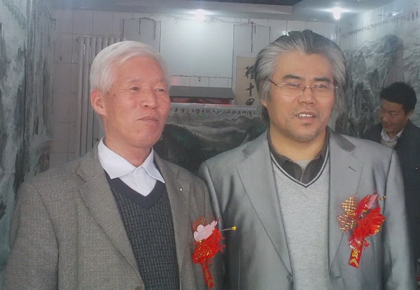 张孝勇与中西文化艺术交流协会书法家孙治国合影